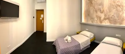 a hospital room with a bed and a flat screen tv at Legends in Rome