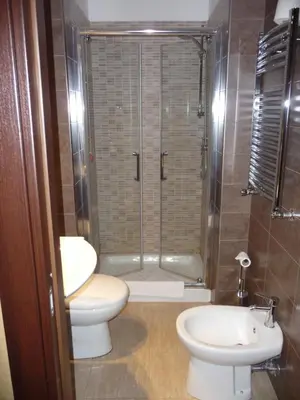 a bathroom with a shower and a toilet and a sink at Nice Rome Holiday in Rome