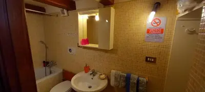 a bathroom with a sink and a toilet at Casa Dino rooms in Rome