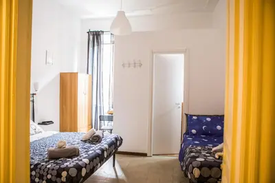 a bedroom with a bed with two teddy bears on it at La Residenza City in Rome