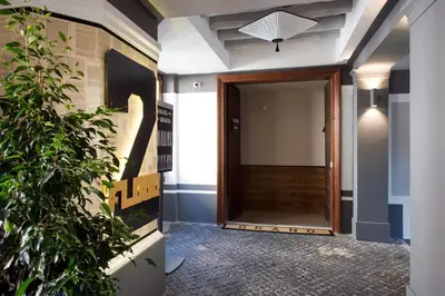 a hallway with a door and a plant at Relais Santa Maria Maggiore in Rome