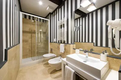 a bathroom with a sink and a toilet and a shower at Relais Santa Maria Maggiore in Rome