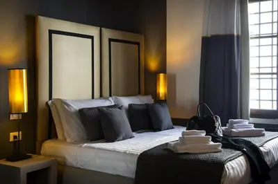 a hotel room with a bed with towels on it at Relais Santa Maria Maggiore in Rome