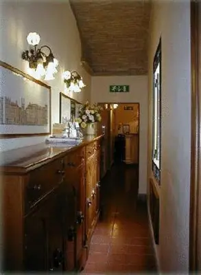 a large kitchen with a sink and a hallway at Hotel Panda in Rome