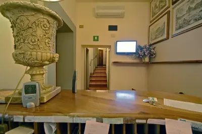 a large vase sitting on top of a table in a room at Hotel Panda in Rome