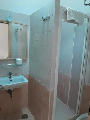 a bathroom with a shower and a sink at Palma Residences In Rome in Rome