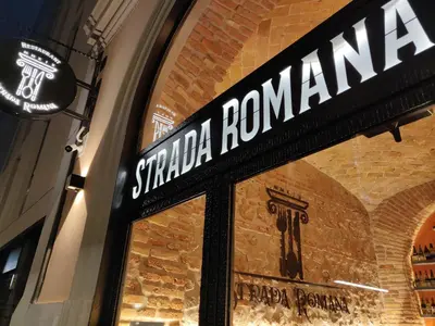 a restaurant with a bar with a guitar on the wall at Alessandro Palace & Bar in Rome