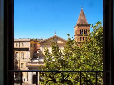 a view from a window of a building with a tower at Sonnino Suite in Rome