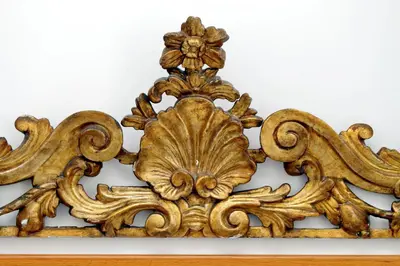 a wooden frame with a flower design on a wall at Sonnino Suite in Rome