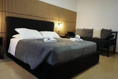 a bedroom with a bed with two towels on it at VMH Vatican Modern House in Rome