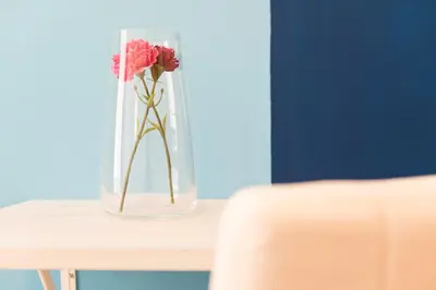 a vase filled with pink flowers sitting on a table at Lorenz Suites Trastevere Hill in Rome
