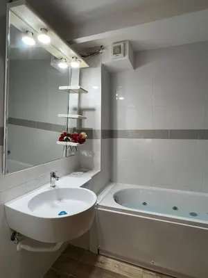 a white bathroom with a sink and a tub at Affitacamere Radi in Rome
