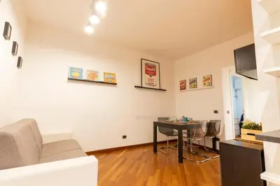a living room with a table and a couch at Borgo Vittorio St. Peter Apartments in Rome