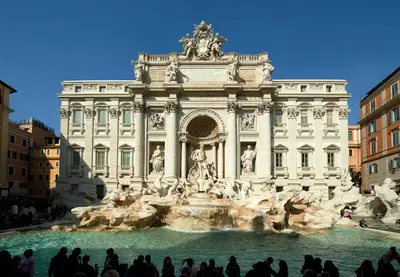 a large building with a fountain in front of it at Harry's Bar Trevi Luxury Apartments - Modelli in Rome