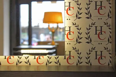 a room with a wall with a patterned wall at Hotel Charter in Rome