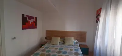 a bedroom with a bed in a room at Trastevere St. Garden House in Rome