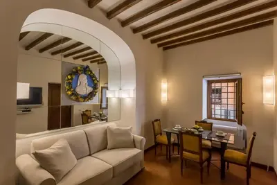 a living room with a couch and a table at Navona apartment in Rome