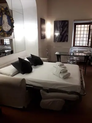a bedroom with a bed with towels on it at Navona apartment in Rome