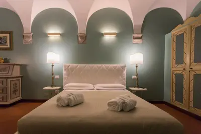 a bedroom with a large bed with two towels on it at Navona apartment in Rome
