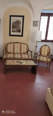 a living room with two couches and a table at Navona apartment in Rome