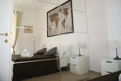 a bedroom with a bed and a glass wall at St.Peter Accomodation in Rome