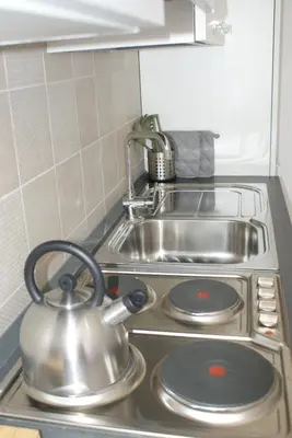 a tea kettle sitting on top of a stove at St.Peter Accomodation in Rome