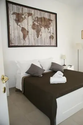 a bedroom with a bed with a map on the wall at St.Peter Accomodation in Rome