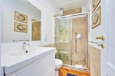 a bathroom with a sink and a shower at Sistina in Rome