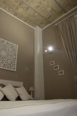 a bedroom with a bed and a ceiling with a window at rHome Sweet Home - Trastevere in Rome