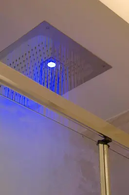 a light above a window in a room at Gigli D'Oro Suite in Rome