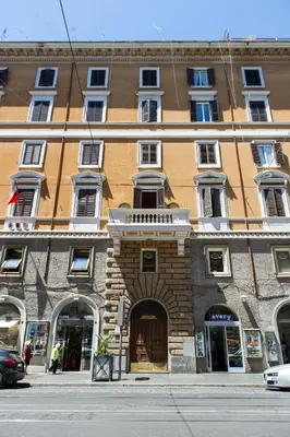 a large brick building on a city street at Ottaviano Exclusive Maison in Rome