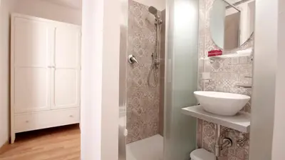 a bathroom with a sink and a mirror at Domus Iuliae in Rome