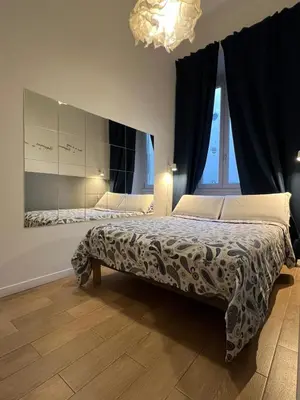 a bedroom with a bed with towels on it at MiRhome Guest House in Rome