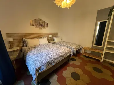 a bathroom with a shower with a table and a sink at MiRhome Guest House in Rome