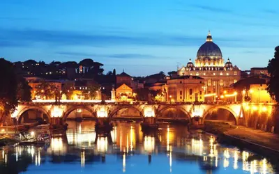 a bridge over the river nervi at night at MiRhome Guest House in Rome