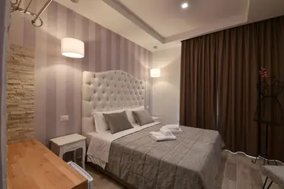 a bedroom with a large bed in a room at Relais Barberini in Rome