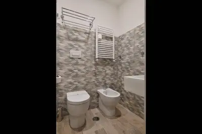 a bathroom with a toilet and a sink at Relais Barberini in Rome