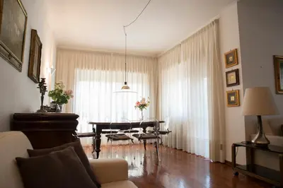 a living room with a table and a couch at Plumbird Boutique & Apartment in Rome