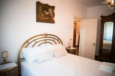 a bedroom with a white bed with white pillows at Plumbird Boutique & Apartment in Rome