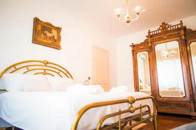 a bedroom with a bed and a mirror at Plumbird Boutique & Apartment in Rome