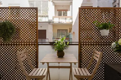 a table and two chairs on a balcony with a table at Residenza Il Giglio in Rome