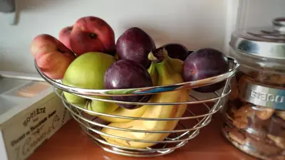 a basket of fruit sitting on top of a counter at Locanda Sant'Anna in Rome