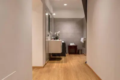 a bathroom with a sink and a mirror at I TRE MOSCHETTIERI - D'ARTAGNAN Luxury Guest House in Rome
