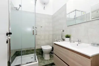 a bathroom with a toilet and a sink and a shower at Residenza Musei Vaticani in Rome