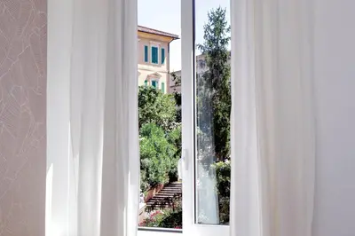 an open window with a view of a building at Residenza Musei Vaticani in Rome
