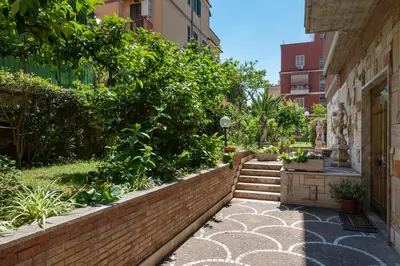 a walkway in the middle of a building with plants at Roma Chic Flat Monte Mario in Rome