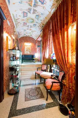 a living room with a coffered ceilings and a room withuming at Hotel Celio in Rome