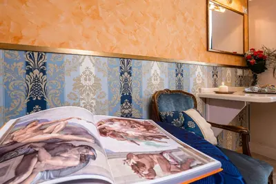 a book laying on a bed in a room at Affittacamere Guest House Glatimia in Rome