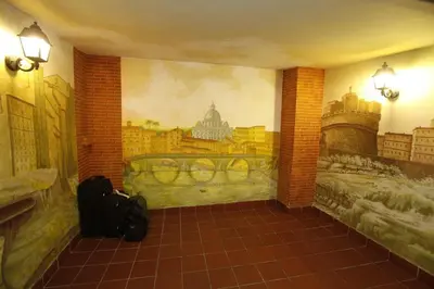 a room with a mural on the wall at Hotel Adriatic in Rome