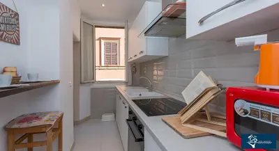 a small kitchen with a sink and a stove at L'Olimpo di Estia in Rome
